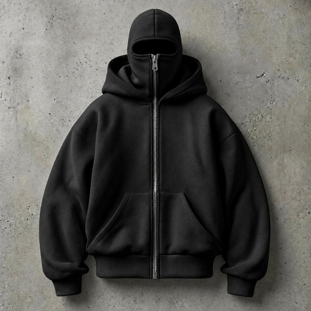HIDDIO double-hood zip-up hoodie in black on a concrete background