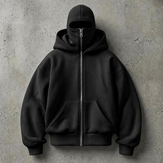 HIDDIO double-hood zip-up hoodie in black on a concrete background